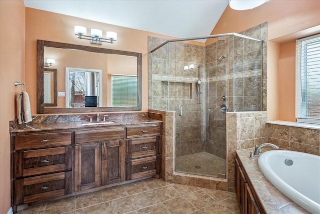 full bath with a garden tub, a stall shower, vanity, and vaulted ceiling