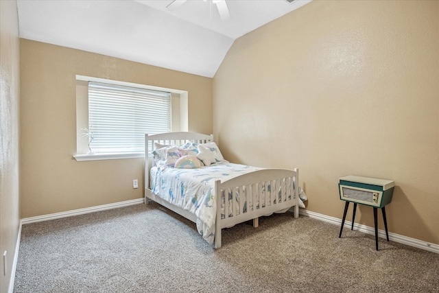 bedroom with vaulted ceiling, carpet flooring, baseboards, and ceiling fan