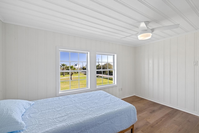 bedroom with wood finished floors and a ceiling fan