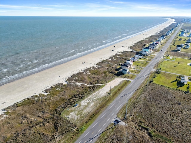 bird's eye view with a view of the beach and a water view