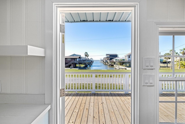 entryway with a water view and wood finished floors