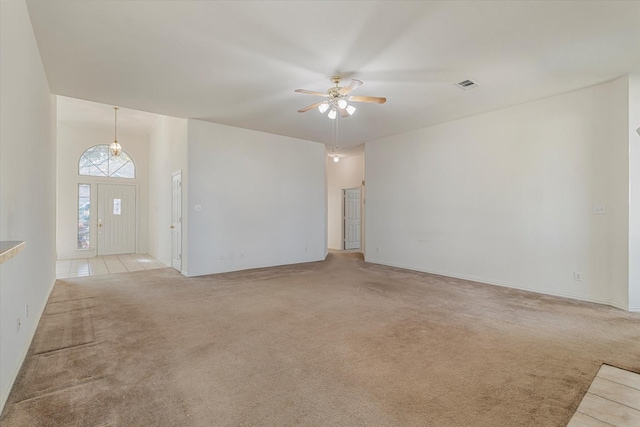 unfurnished living room featuring light carpet, visible vents, and ceiling fan