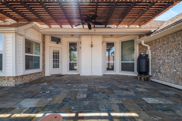 view of patio / terrace with a ceiling fan and a pergola