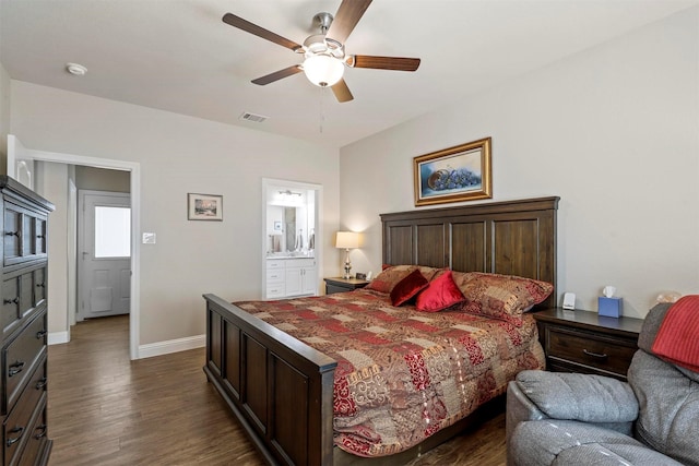 bedroom with a ceiling fan, baseboards, visible vents, dark wood-type flooring, and connected bathroom