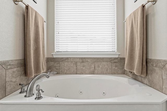 full bath featuring a jetted tub