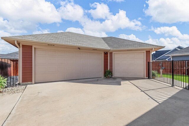 garage featuring fence