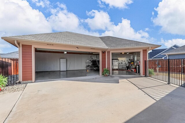 garage with a workshop area, wood ceiling, and a garage door opener