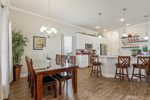 dining space with visible vents, ornamental molding, baseboards, and dark wood-style flooring