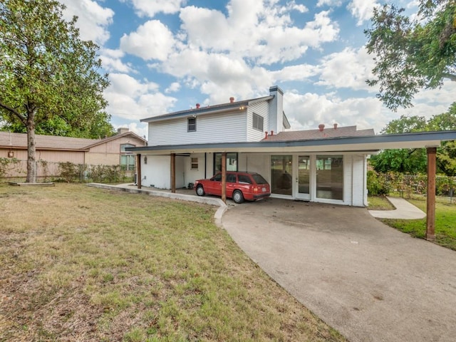 1253 Willow Glen Dr, Dallas, TX 75232 - rear view of property with a chimney, a yard, and concrete driveway