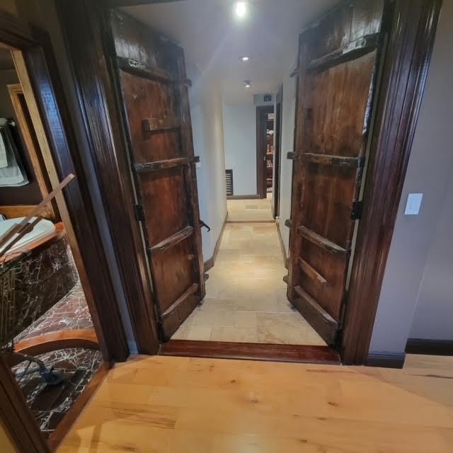 corridor featuring visible vents, recessed lighting, and light wood-style floors