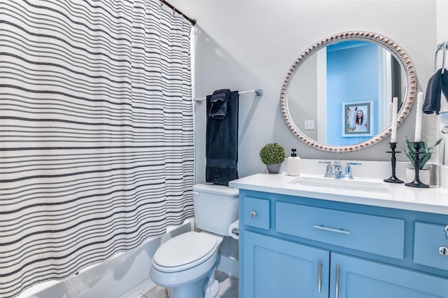 bathroom featuring shower / bath combo with shower curtain, vanity, and toilet