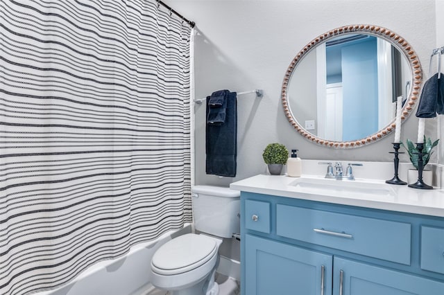 full bath featuring shower / bath combo, vanity, and toilet