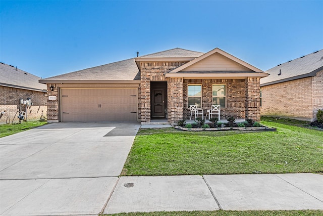 view of front of house featuring brick siding, concrete driveway, a front yard, covered porch, and an attached garage