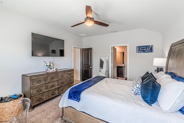 bedroom with visible vents, connected bathroom, ceiling fan, light colored carpet, and lofted ceiling