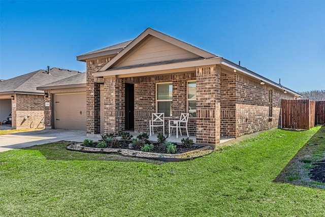 view of front of house with brick siding, a front lawn, concrete driveway, covered porch, and a garage