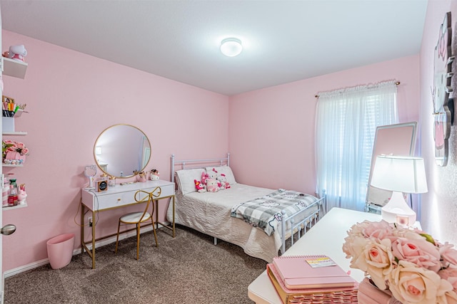 carpeted bedroom with baseboards