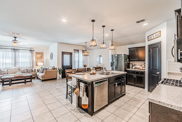 kitchen featuring ceiling fan, visible vents, appliances with stainless steel finishes, and a sink