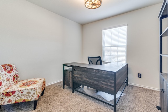 home office with baseboards and carpet floors