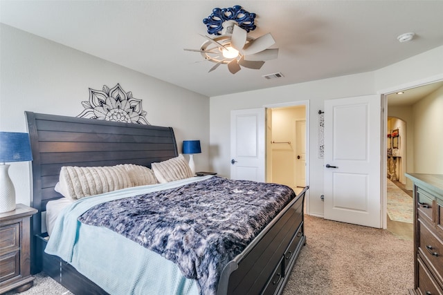 bedroom with arched walkways, visible vents, light colored carpet, and a ceiling fan