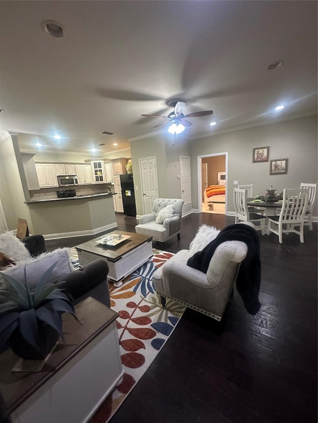 living room with dark wood finished floors, crown molding, recessed lighting, and ceiling fan