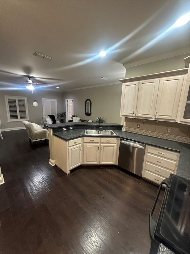 kitchen featuring visible vents, dishwasher, ornamental molding, a peninsula, and a sink