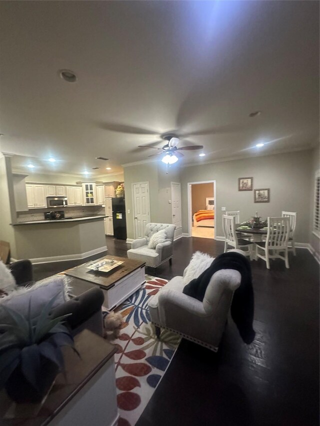 living room featuring recessed lighting, a ceiling fan, dark wood-type flooring, and baseboards