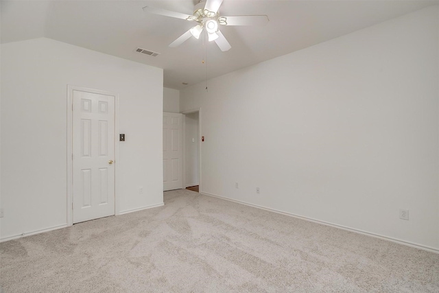 unfurnished bedroom with visible vents, light carpet, baseboards, and ceiling fan