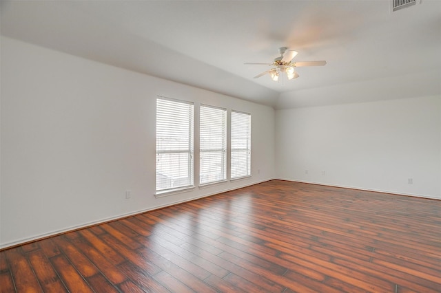 unfurnished room featuring visible vents, a ceiling fan, lofted ceiling, and hardwood / wood-style floors