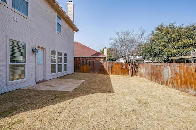 view of yard with a patio and a fenced backyard