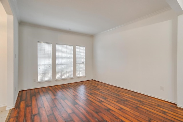 unfurnished room with hardwood / wood-style floors and ornamental molding