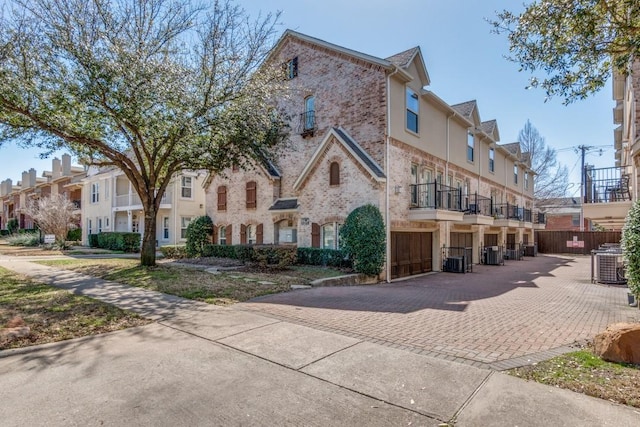 multi unit property with brick siding and central AC unit