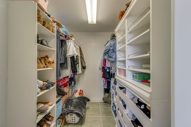 spacious closet featuring tile patterned floors