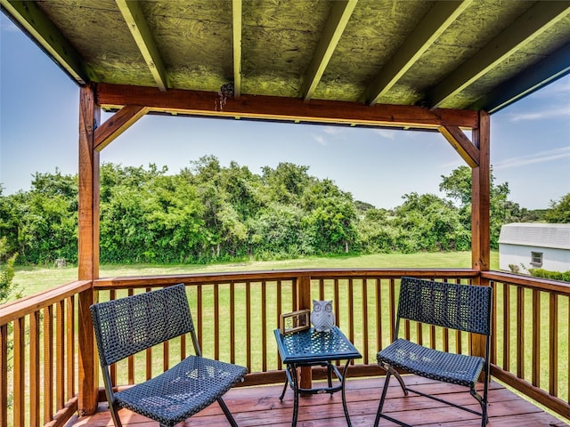 wooden deck with a yard