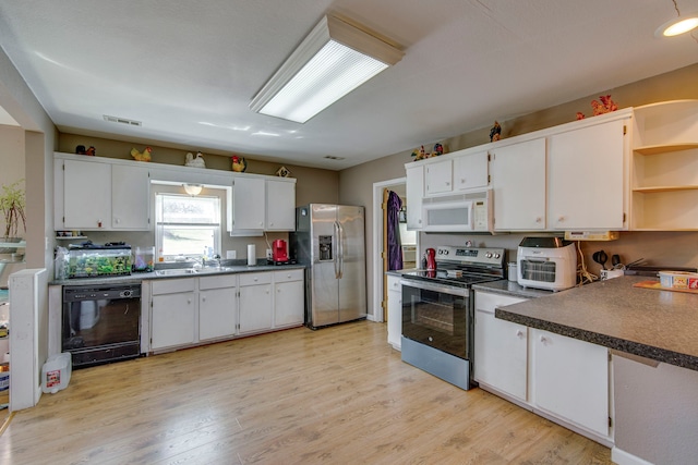 kitchen featuring visible vents, stainless steel appliances, light wood-style floors, white cabinetry, and open shelves