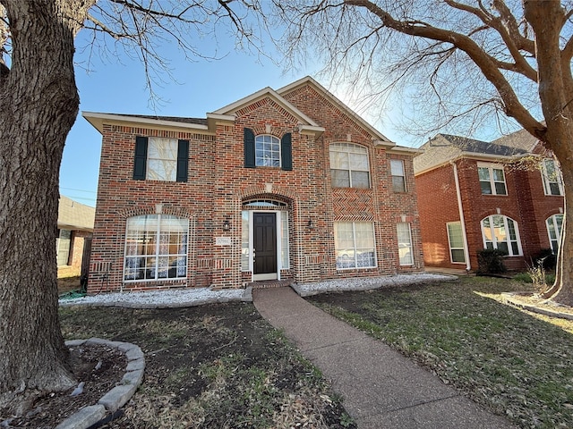 view of front of home with brick siding