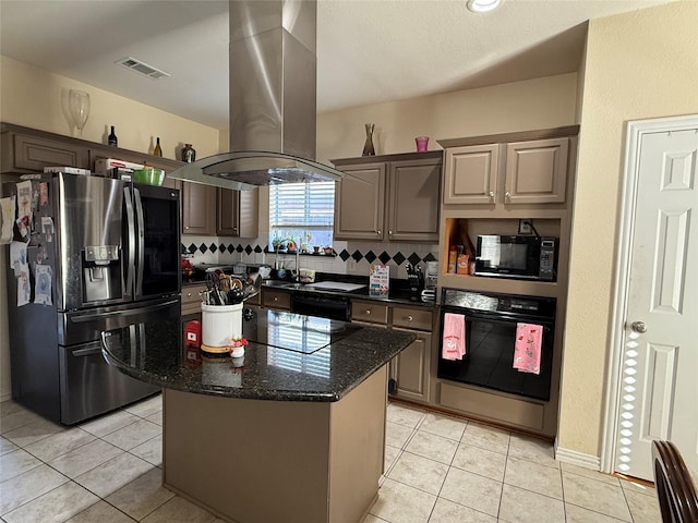 kitchen featuring island exhaust hood, backsplash, black appliances, and light tile patterned floors