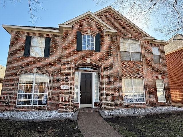 view of front of home with brick siding