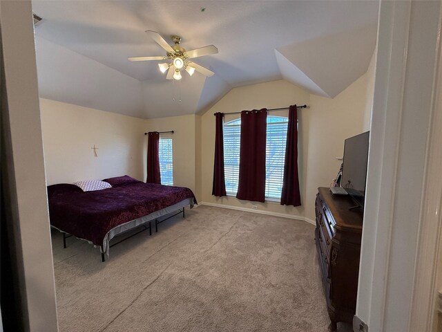 bedroom with vaulted ceiling, multiple windows, baseboards, and carpet floors