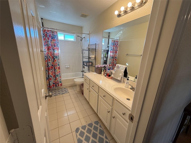 full bathroom with visible vents, toilet, shower / tub combo, tile patterned floors, and vanity