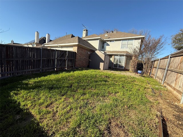 view of yard with a fenced backyard