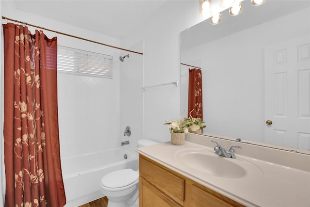 bathroom with toilet, vanity, and shower / bath combination with curtain