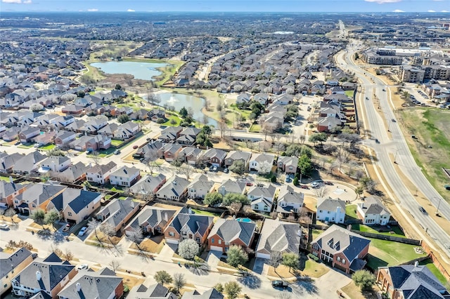 aerial view featuring a residential view and a water view