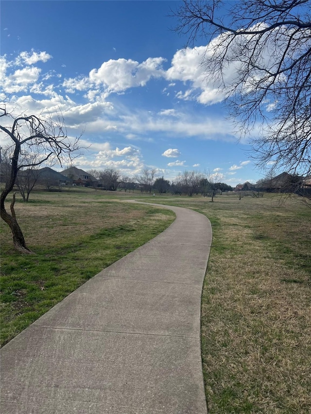 surrounding community featuring a rural view, a lawn, and a mountain view