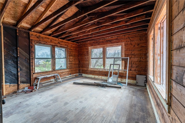 interior space with lofted ceiling and hardwood / wood-style floors