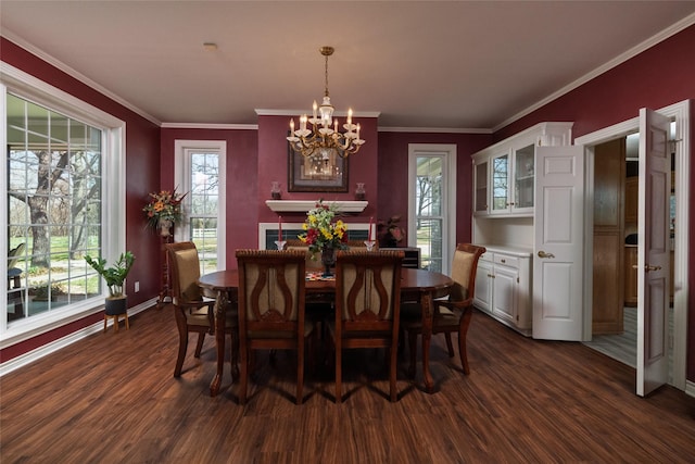 dining space featuring an inviting chandelier, dark wood-style floors, baseboards, and ornamental molding