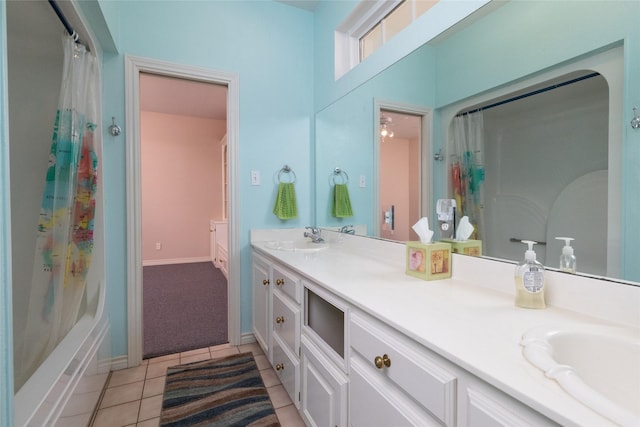 full bathroom with tile patterned floors, curtained shower, double vanity, and a sink