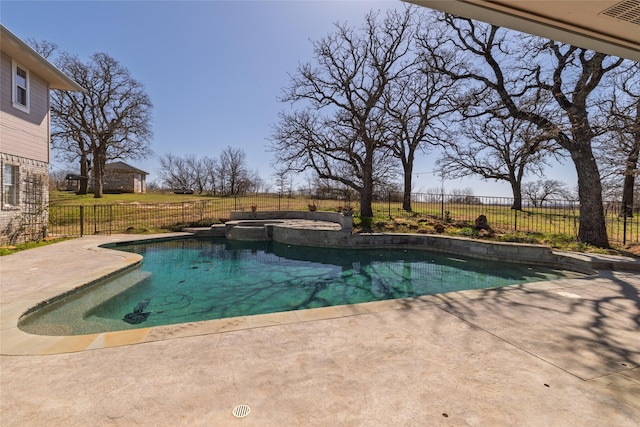 view of swimming pool with a patio area, fence, and a pool with connected hot tub