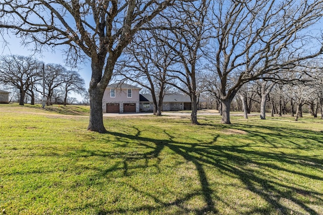 view of yard featuring a garage