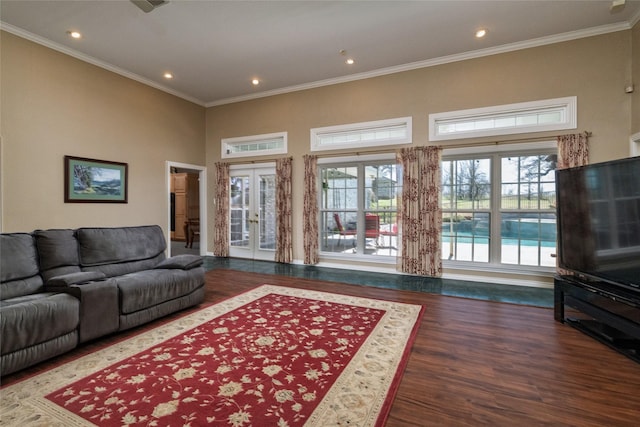 living area with plenty of natural light, recessed lighting, crown molding, and wood finished floors