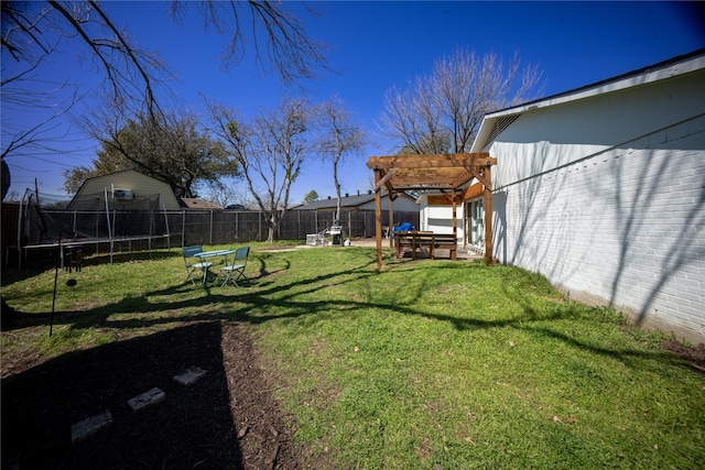 view of yard with a patio, a trampoline, a fenced backyard, and a pergola